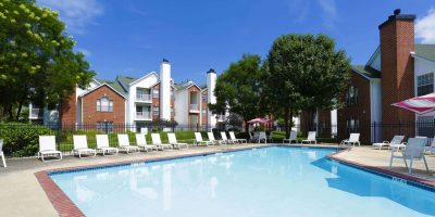 A swimming pool outside of a Donaldson apartment community