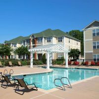 A swimming pool outside of a Donaldson apartment community