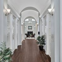 Hall to clubroom with fireplace